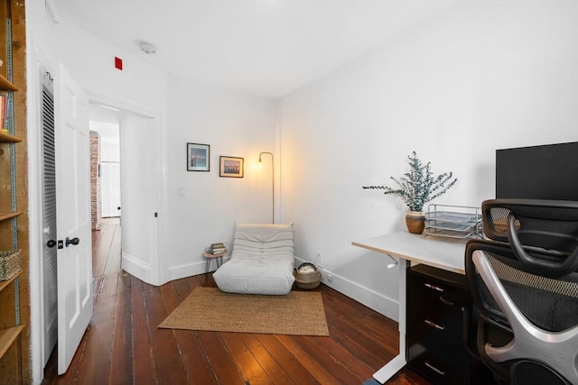 office area with baseboards and hardwood / wood-style flooring