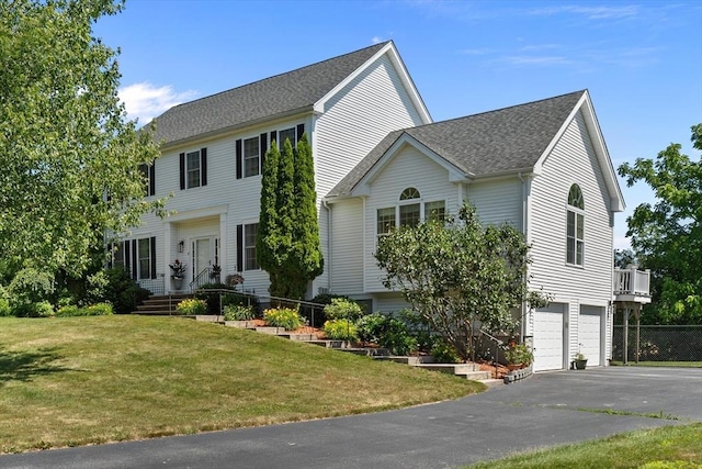 8 Mill River Ln, Rowley, MA 01969 - colonial home featuring driveway, an attached garage, a front yard, and roof with shingles