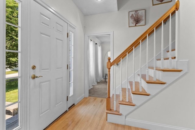 8 Mill River Ln, Rowley, MA 01969 - foyer entrance with light wood-style floors and stairway