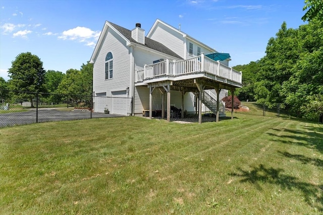 8 Mill River Ln, Rowley, MA 01969 - rear view of house with a deck, stairway, a garage, asphalt driveway, and a chimney