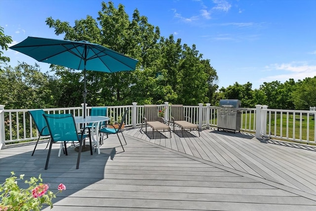 8 Mill River Ln, Rowley, MA 01969 - wooden terrace with outdoor dining area, a grill, and view of scattered trees