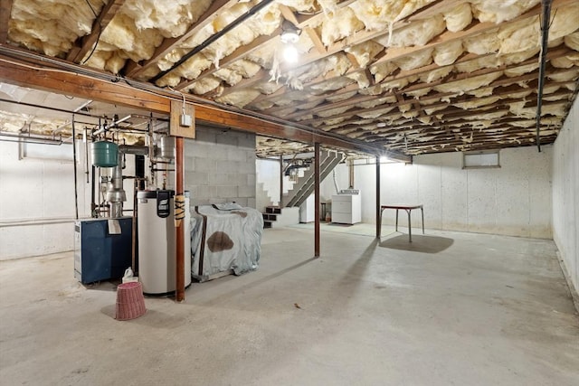 unfinished below grade area featuring stairs, gas water heater, a heating unit, and separate washer and dryer