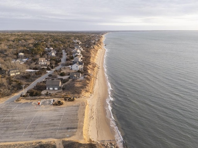 bird's eye view featuring a water view and a beach view