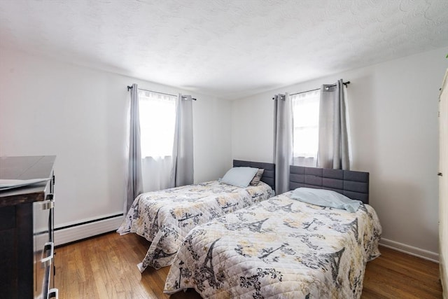 14 Bayside St, Springfield, MA 01109 - bedroom with a baseboard radiator, multiple windows, and wood finished floors