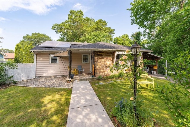 14 Bayside St, Springfield, MA 01109 - view of front of house with roof mounted solar panels and roof with shingles