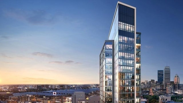 view of outdoor building at dusk