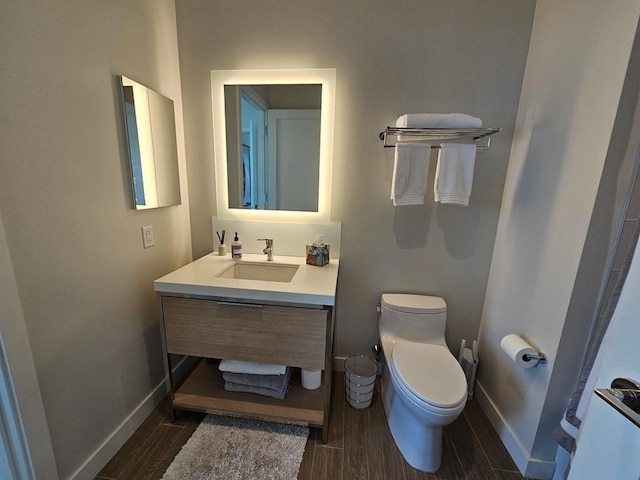 bathroom featuring toilet and vanity