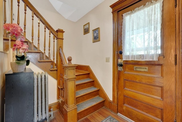 50 Oleander St, West Springfield, MA 01089 - foyer entrance featuring stairway, wood finished floors, and radiator