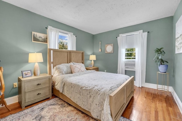 50 Oleander St, West Springfield, MA 01089 - bedroom featuring wood finished floors and a textured ceiling