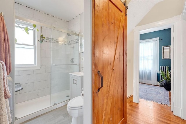 50 Oleander St, West Springfield, MA 01089 - bathroom featuring a stall shower, healthy amount of natural light, and wood finished floors