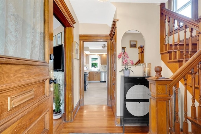 50 Oleander St, West Springfield, MA 01089 - corridor with light wood-style flooring, stairs, and arched walkways