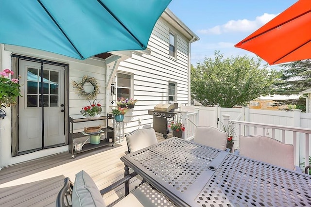 50 Oleander St, West Springfield, MA 01089 - wooden terrace with outdoor dining area and a grill
