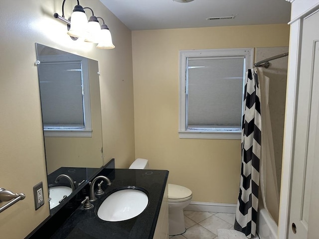 full bathroom with vanity, a shower with curtain, visible vents, tile patterned floors, and toilet