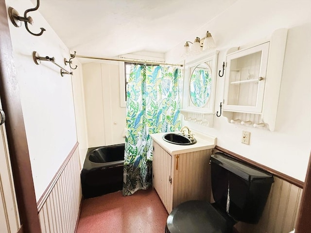 bathroom with shower / bath combination with curtain and vanity
