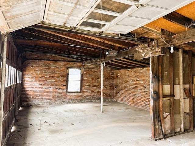 basement featuring brick wall