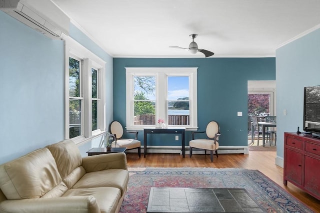 2 Howland Ave, Dartmouth, MA 02748 - living room with wood finished floors, ceiling fan, crown molding, a baseboard heating unit, and baseboards