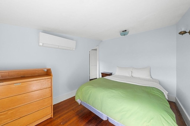 2 Howland Ave, Dartmouth, MA 02748 - bedroom featuring a wall mounted AC, wood finished floors, and baseboards