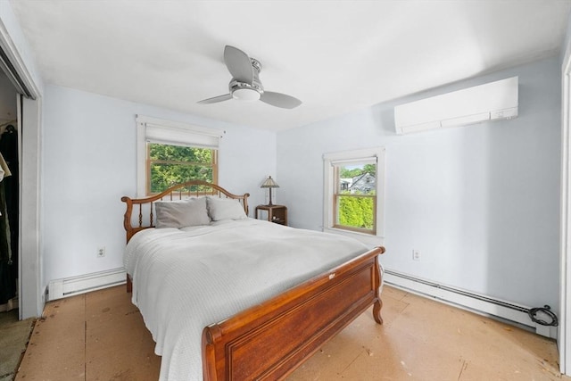 2 Howland Ave, Dartmouth, MA 02748 - bedroom featuring a wall unit AC, baseboard heating, multiple windows, and a baseboard heating unit