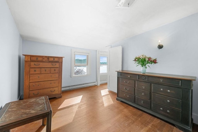 2 Howland Ave, Dartmouth, MA 02748 - bedroom with baseboard heating and wood finished floors
