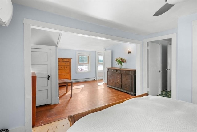 2 Howland Ave, Dartmouth, MA 02748 - bedroom with baseboard heating, wood finished floors, and ceiling fan