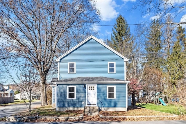 view of front of property with a front lawn