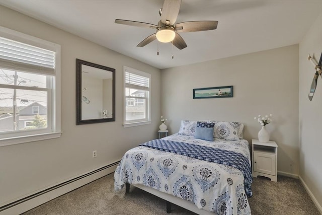 18 River St, Seabrook, NH 03874 - carpeted bedroom featuring baseboard heating, baseboards, and a ceiling fan