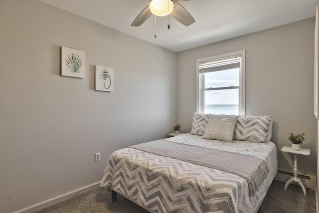 18 River St, Seabrook, NH 03874 - carpeted bedroom featuring a ceiling fan, a baseboard heating unit, and baseboards