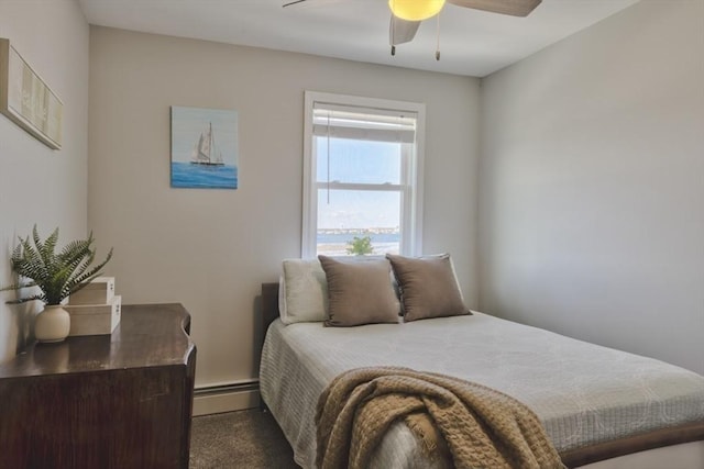 18 River St, Seabrook, NH 03874 - carpeted bedroom featuring a baseboard radiator and ceiling fan