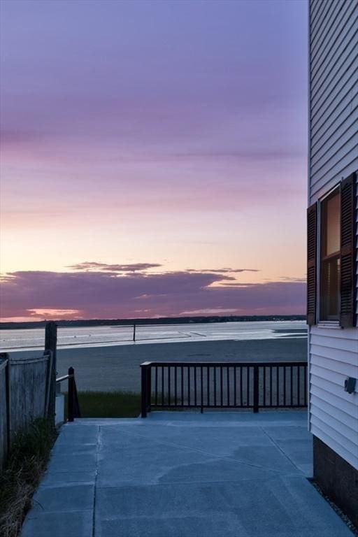 18 River St, Seabrook, NH 03874 - patio terrace at dusk with a water view