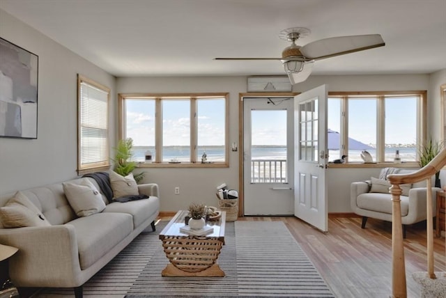 18 River St, Seabrook, NH 03874 - living room with plenty of natural light, a ceiling fan, light wood-type flooring, and a water and mountain view