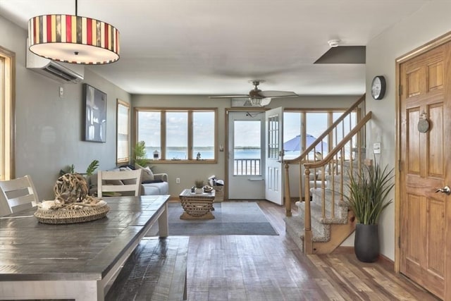 18 River St, Seabrook, NH 03874 - entrance foyer with wood finished floors, stairs, and ceiling fan