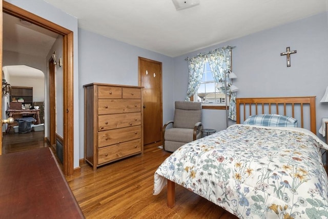 bedroom featuring wood-type flooring