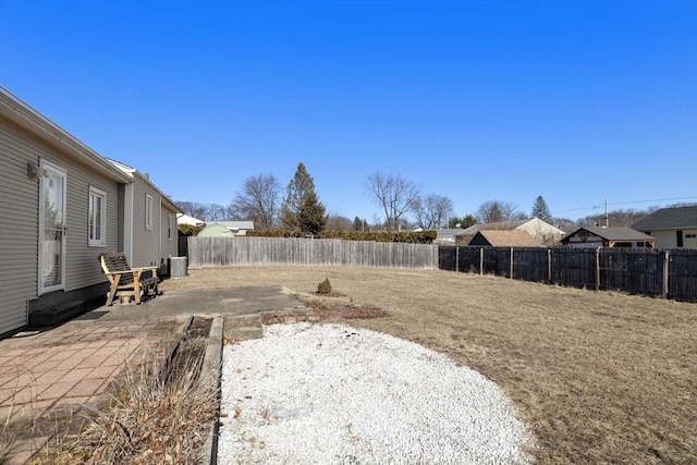 view of yard with a patio area and central air condition unit