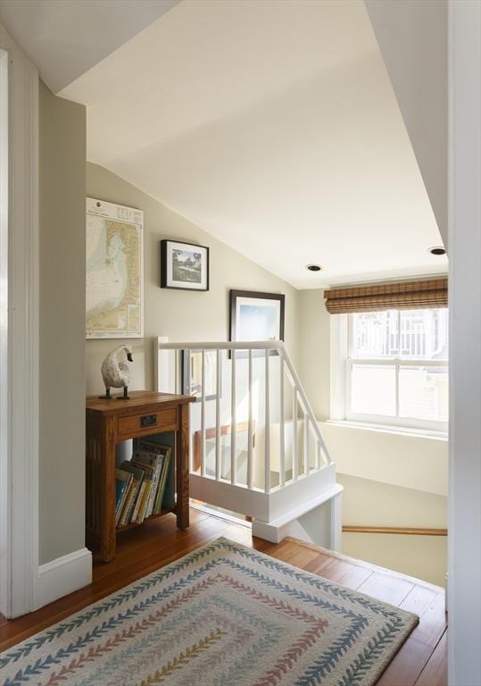 interior space with vaulted ceiling and hardwood / wood-style floors