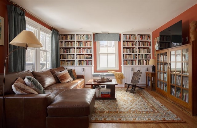 sitting room with hardwood / wood-style floors