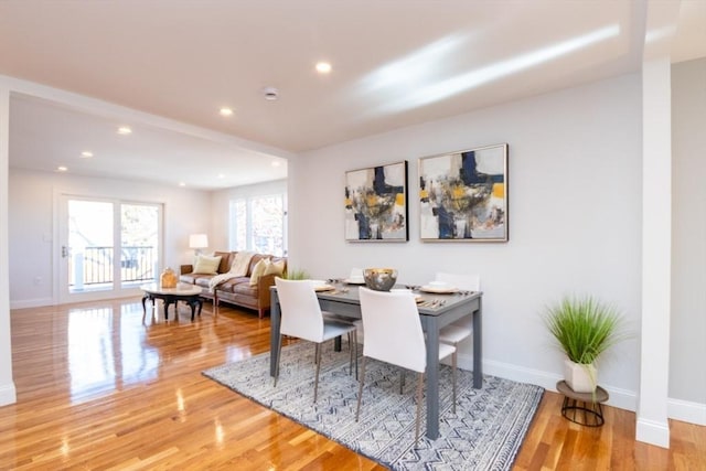 dining area featuring recessed lighting, wood finished floors, and baseboards