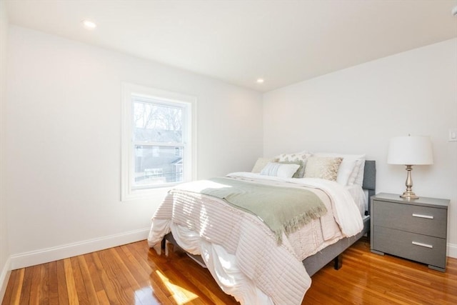 bedroom featuring recessed lighting, baseboards, and wood finished floors