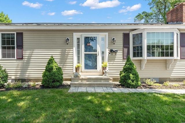 16 Grosvenor St, Ayer, MA 01432 - view of exterior entry featuring a yard