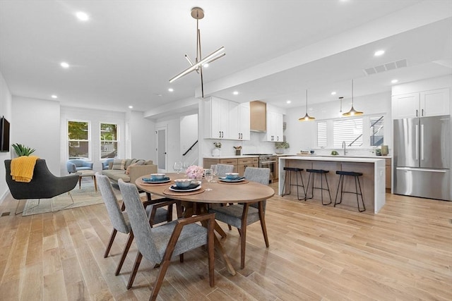 16 Edgar Ave, Somerville, MA 02145 - dining space featuring light wood finished floors and recessed lighting