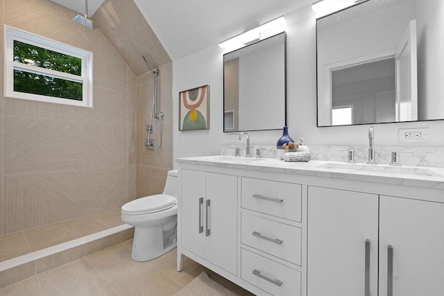 16 Edgar Ave, Somerville, MA 02145 - full bathroom with toilet, double vanity, tiled shower, tile patterned flooring, and vaulted ceiling