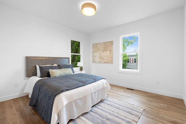 16 Edgar Ave, Somerville, MA 02145 - bedroom with wood finished floors and baseboards