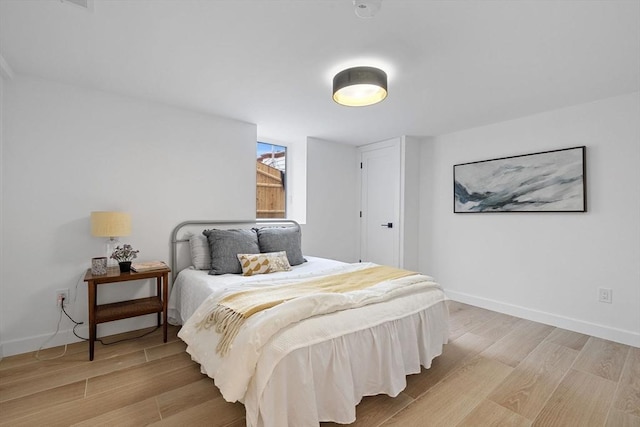 16 Edgar Ave, Somerville, MA 02145 - bedroom with light wood-type flooring and baseboards