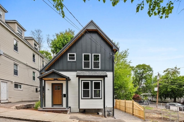 16 Edgar Ave, Somerville, MA 02145 - view of front of property with board and batten siding and fence