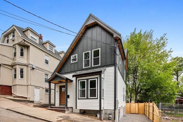 16 Edgar Ave, Somerville, MA 02145 - view of front of property with fence and board and batten siding