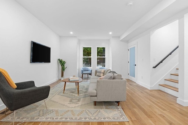 16 Edgar Ave, Somerville, MA 02145 - living room with stairway, recessed lighting, light wood-type flooring, and baseboards