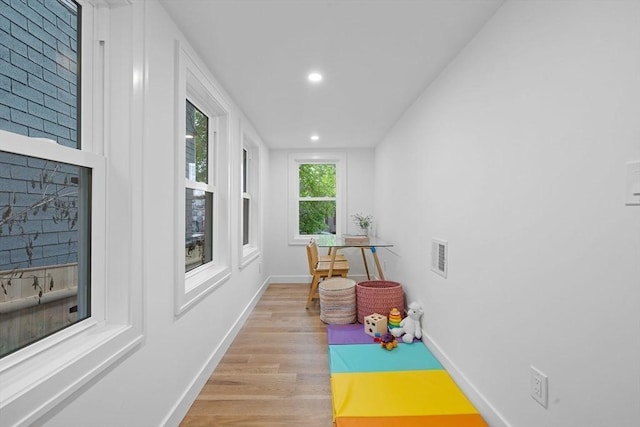 16 Edgar Ave, Somerville, MA 02145 - rec room featuring wood finished floors, baseboards, and recessed lighting