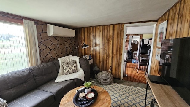 living room featuring a wall mounted air conditioner, wood walls, and light colored carpet