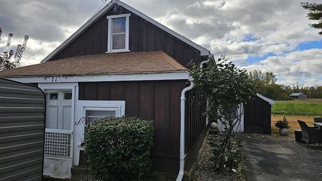 view of home's exterior featuring an outbuilding