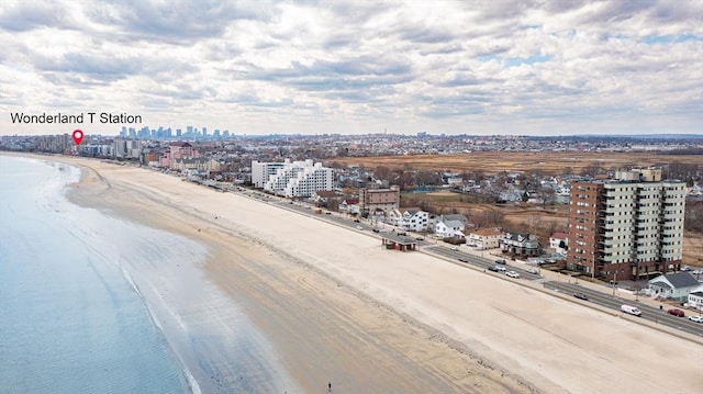 view of urban area featuring expansive beach