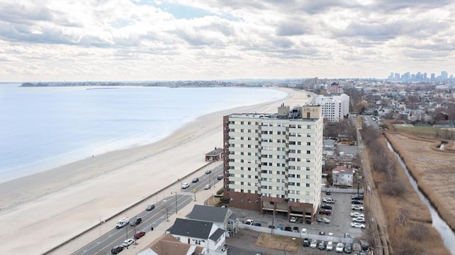 view of urban area with a large body of water